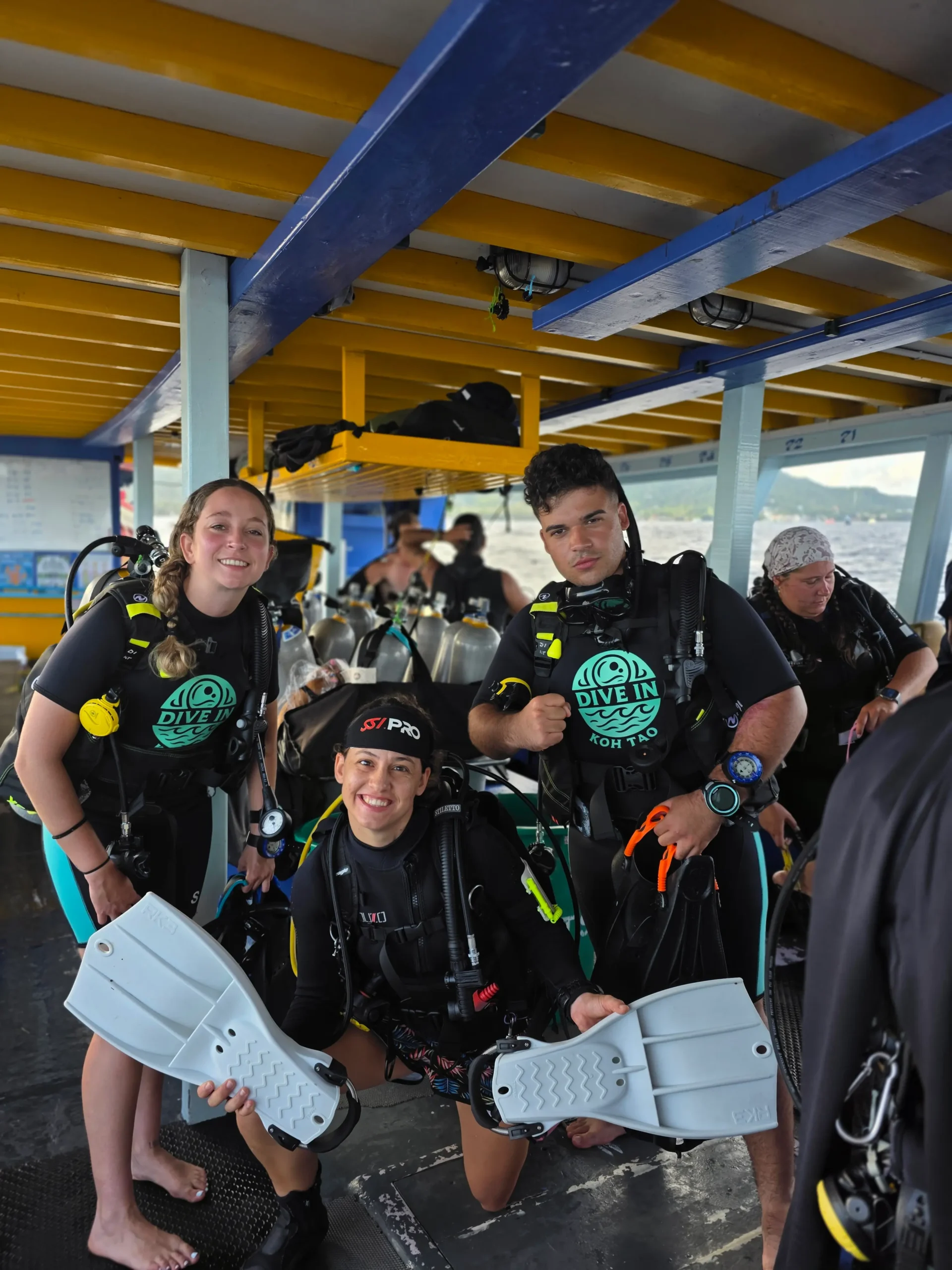 SSI Open Water students with instructor Iris Palmeirim de Alfarra after completing their scuba diving course in Koh Tao, Thailand