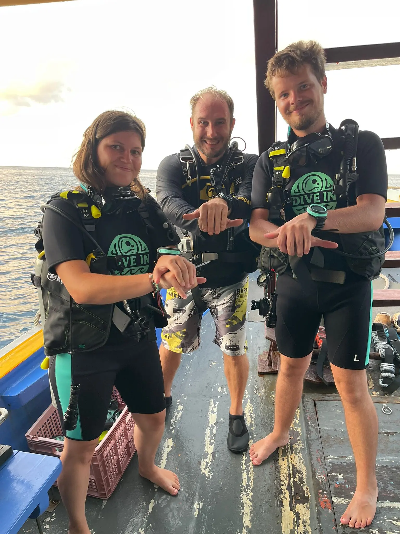 SSI Advanced Open Water students with instructor Gerard after a night dive in Koh Tao, Thailand
