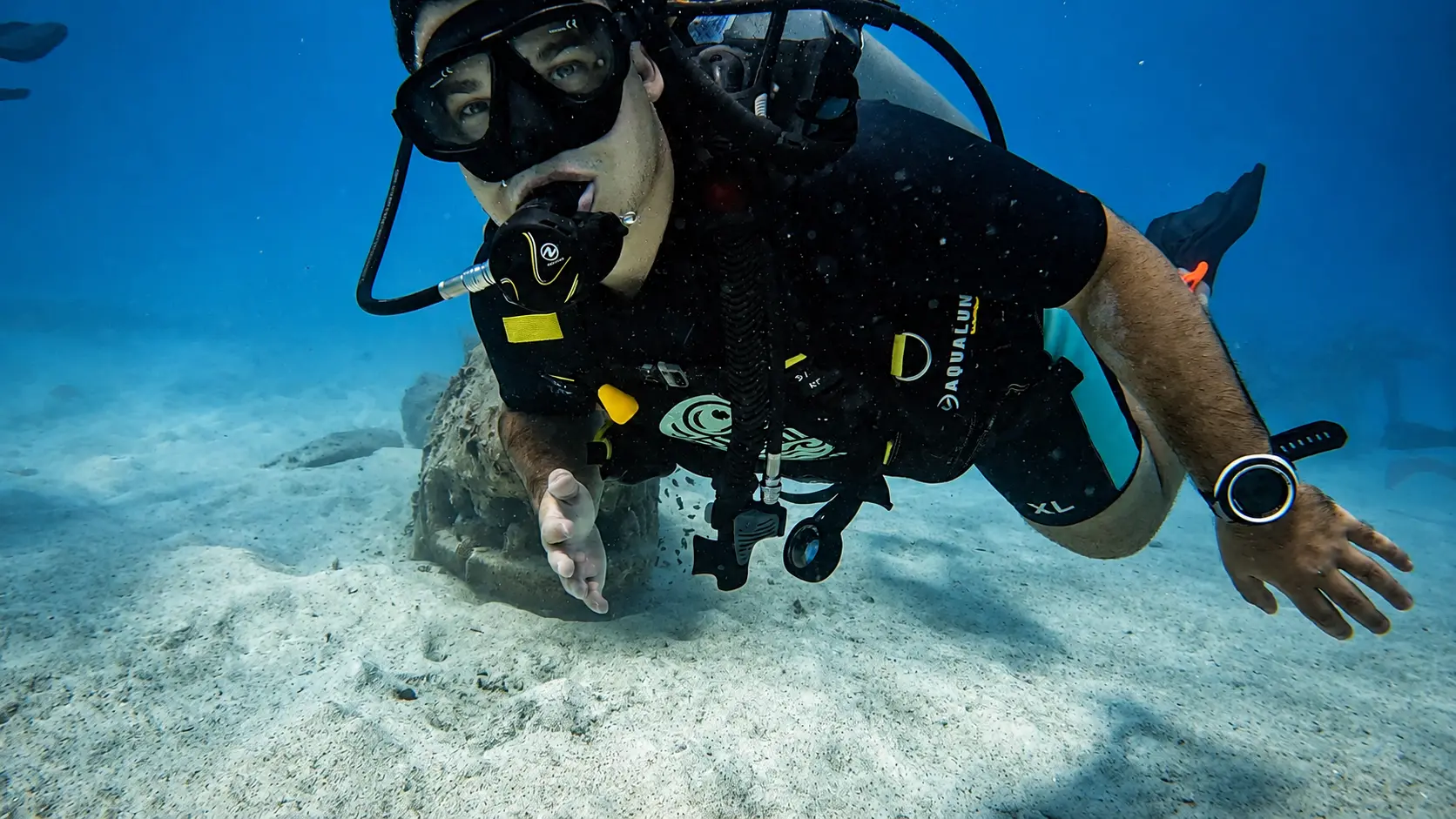 Scuba diver exploring the underwater world during a fun dive in Koh Tao, Thailand